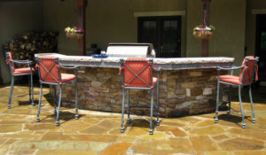 patio with stone bar and grill area with bar chairs